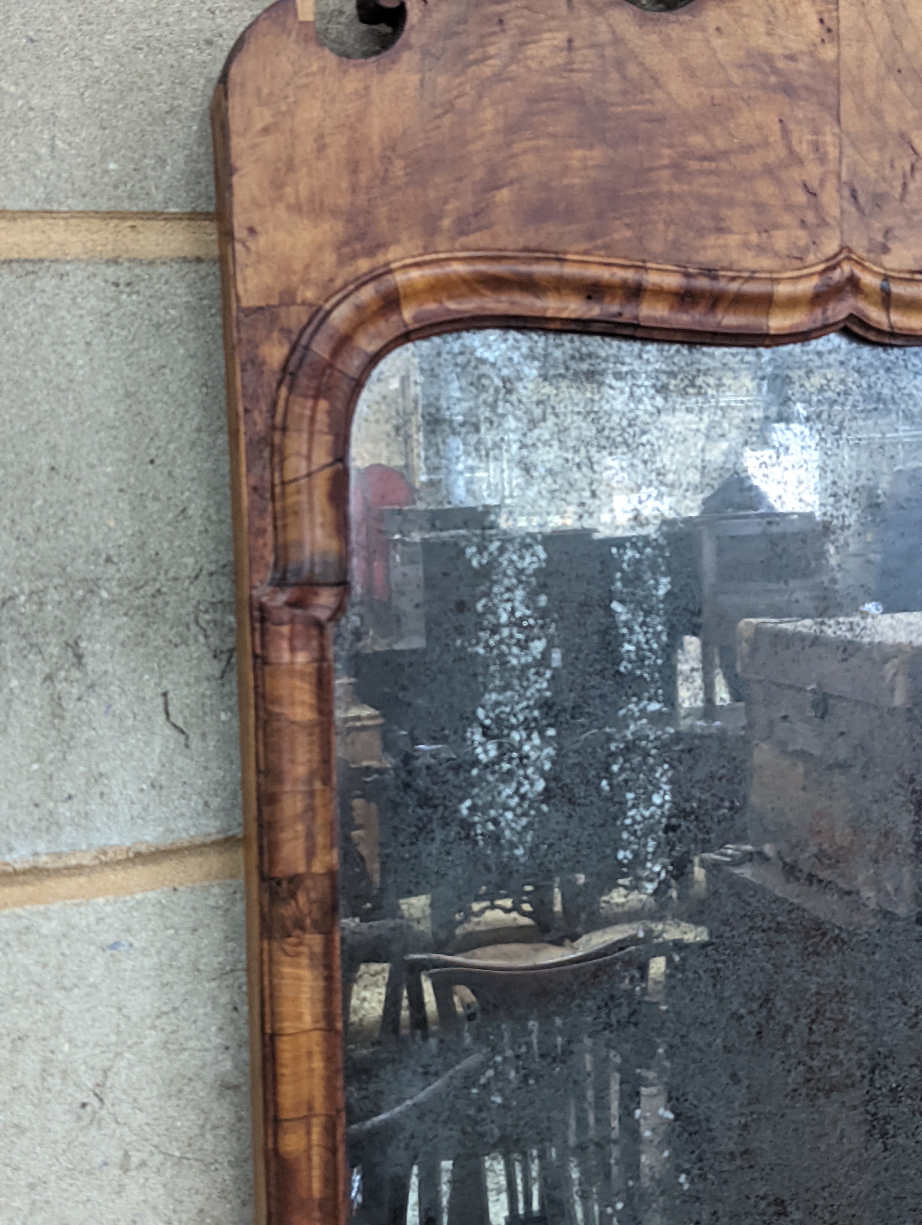 An 18th century walnut fret cut wall mirror, width 48cm, height 96cm